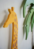 Kopf des Wandspielzeugs "Giraffe" in gelb